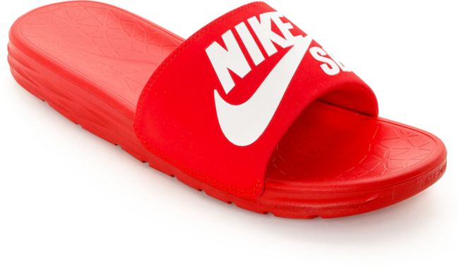 gold and red nike flip flops